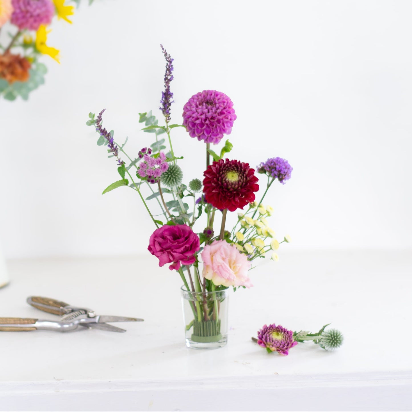 Small round pin holder kenzan flower frog wiht flowers made by Floral Genius