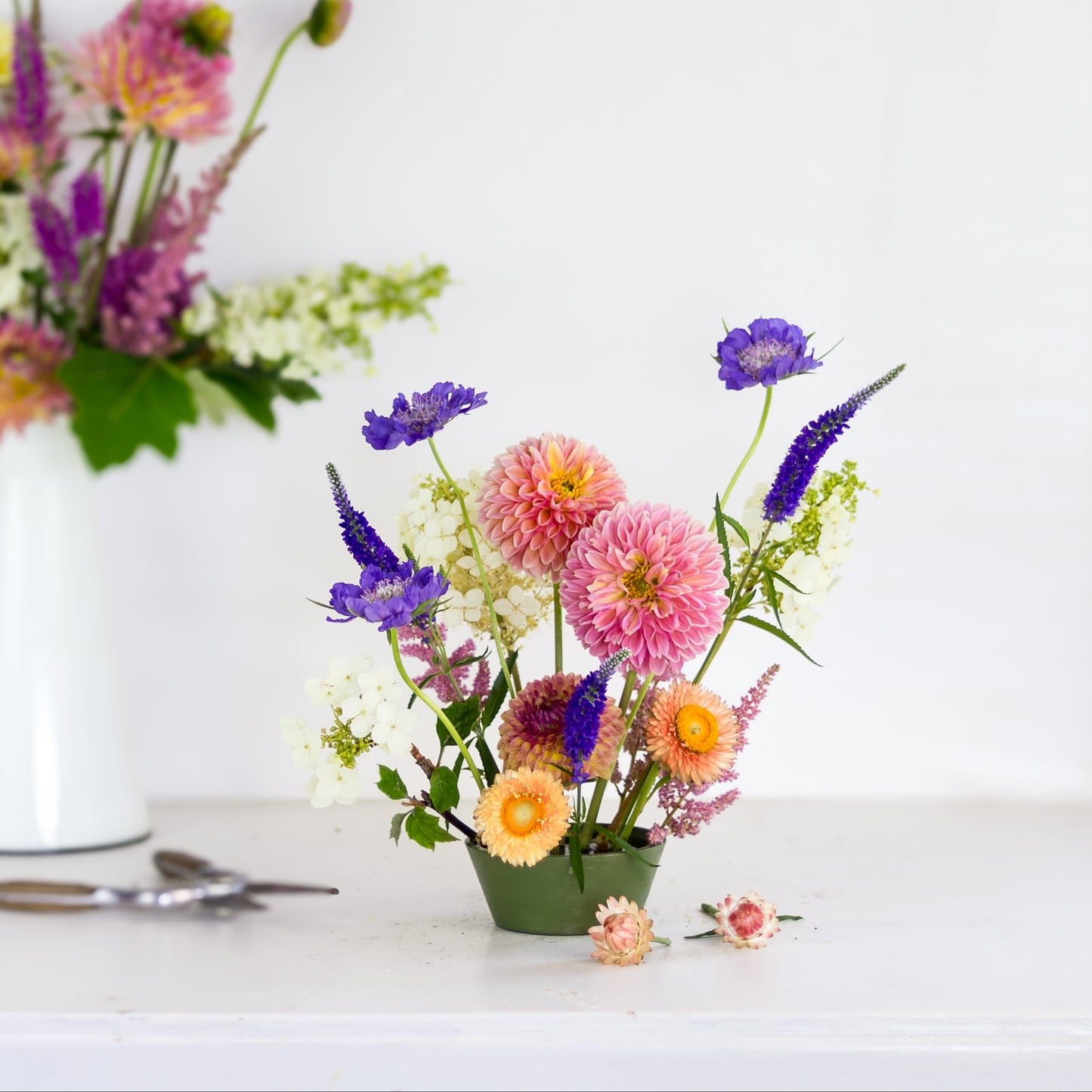 Large tapered pin cup Floral Genius flower frog kenzan with flowers.