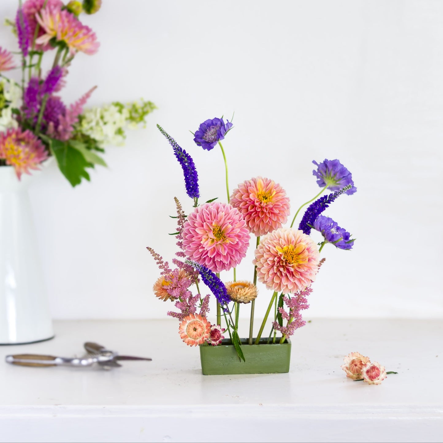 rectangle pin cup flower frog kenzan with flowers made by Floral Genius